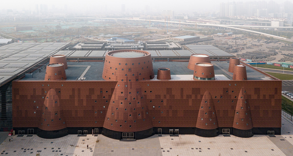 Bernard Tschumi's Exploratorium features copper-clad cones addressing Tianjin's industrial past