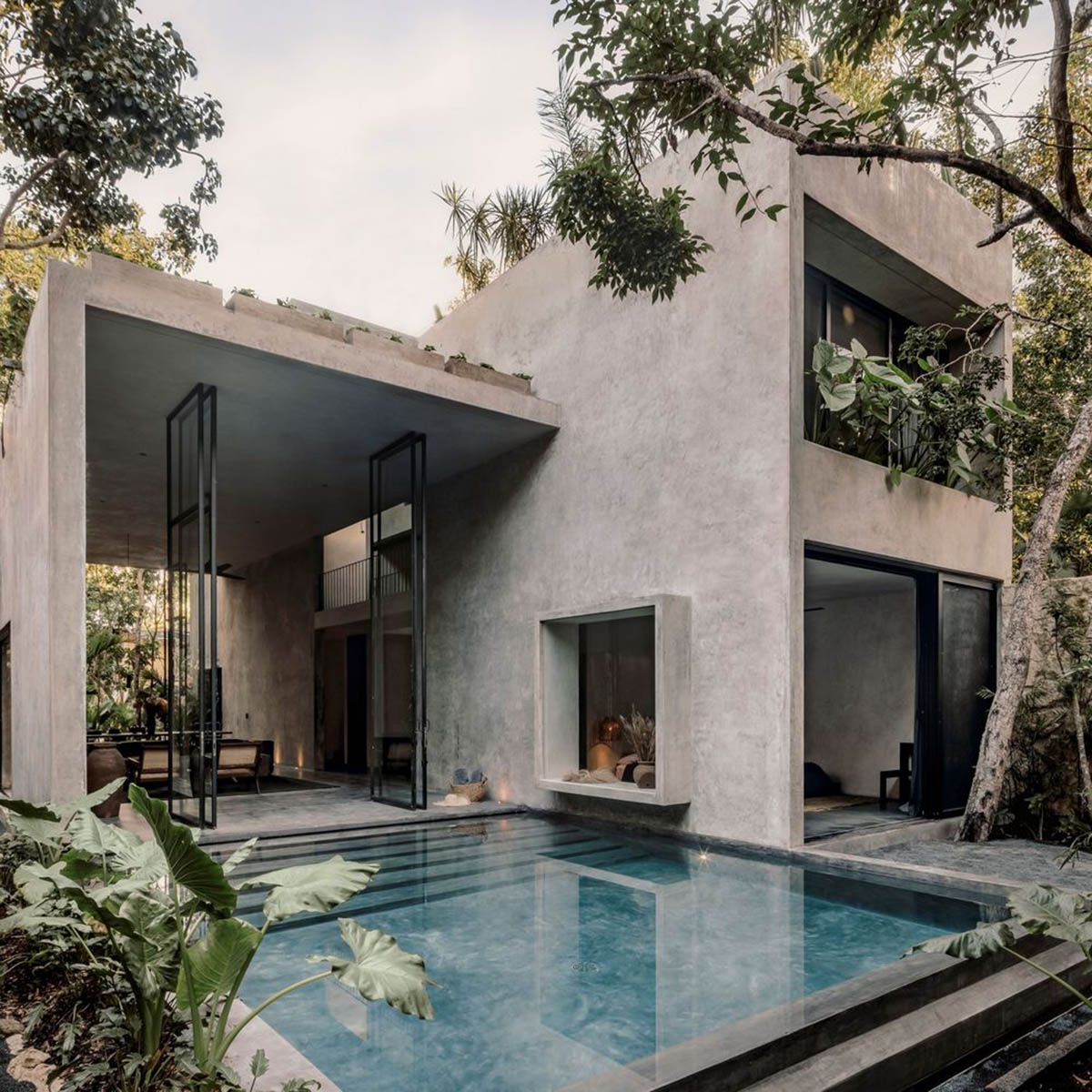 CO-LAB Design Office built concrete villa framing a lush jungle in Tulum
