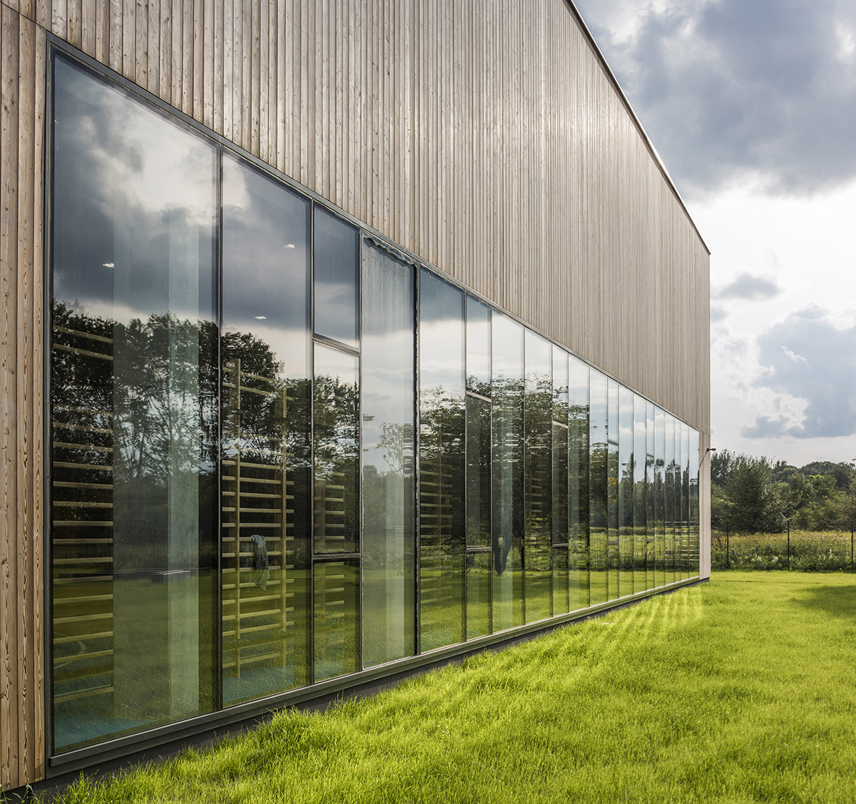 Huge tribunes invite students to sit and experience the courtyard in Warsaw's Akademeia High School