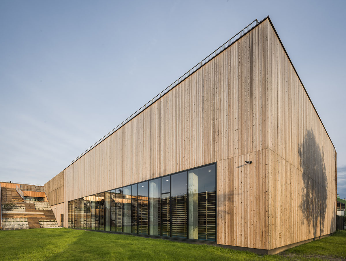 Huge tribunes invite students to sit and experience the courtyard in Warsaw's Akademeia High School