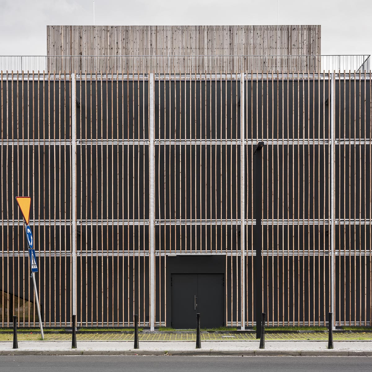 Huge tribunes invite students to sit and experience the courtyard in Warsaw's Akademeia High School
