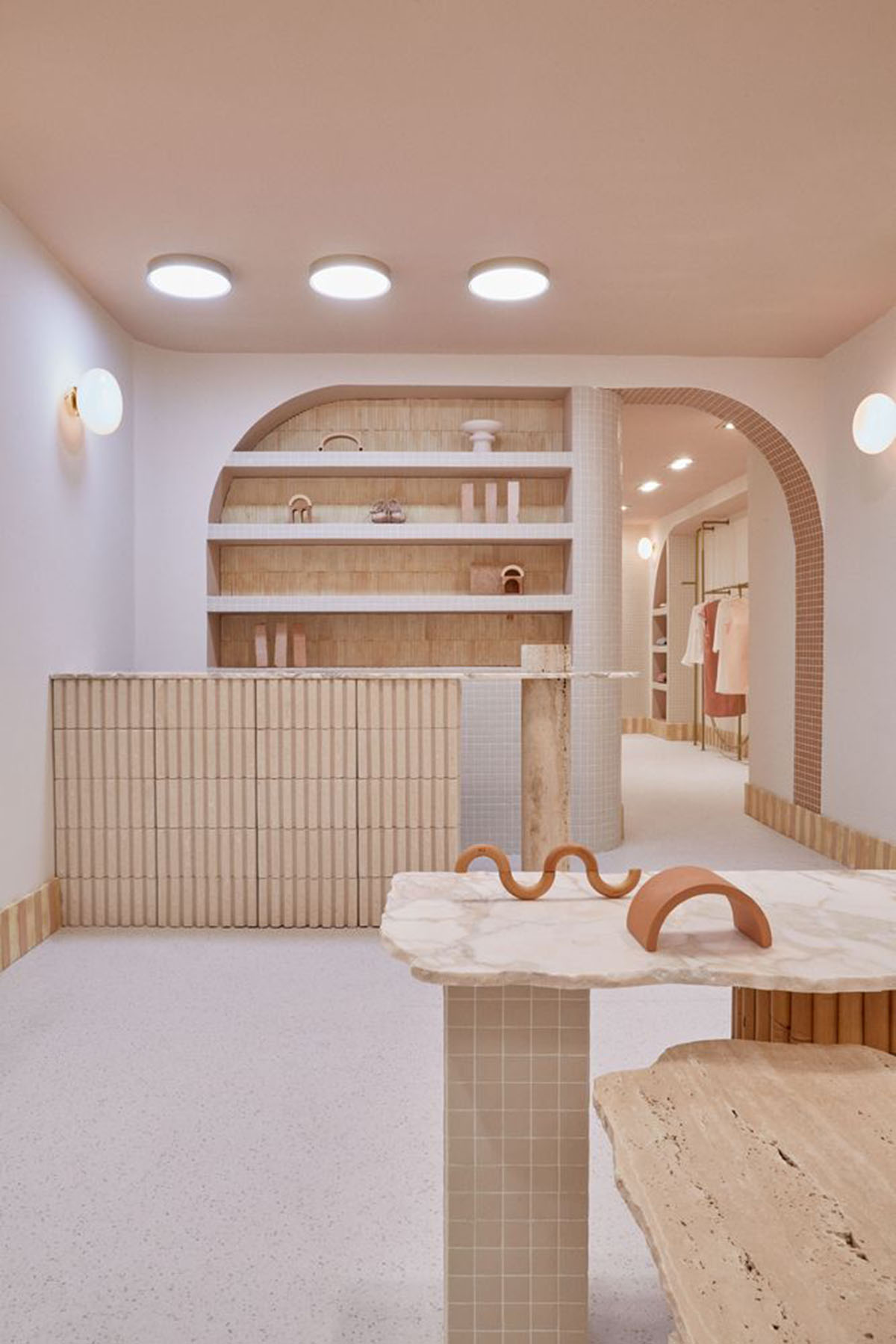 Patricia Bustos Studio creates light pink interiors with arched details for  concept store in Madrid