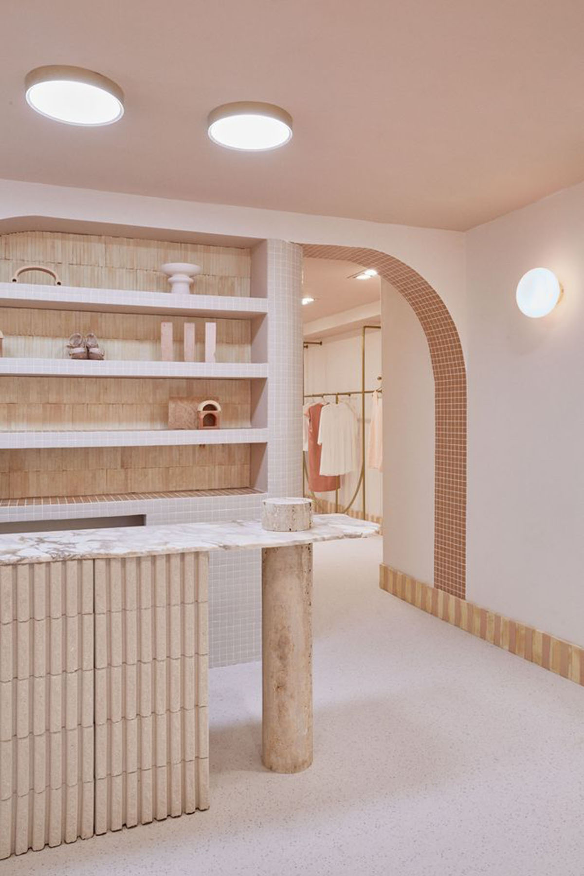 Patricia Bustos Studio creates light pink interiors with arched details for  concept store in Madrid