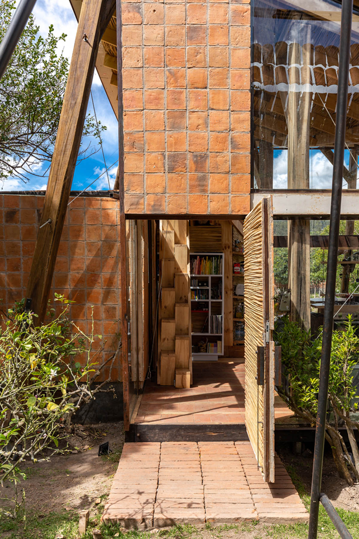 Daniel Moreno Flores creates welcoming screen with hanging tiles to mark this house in Ecuador