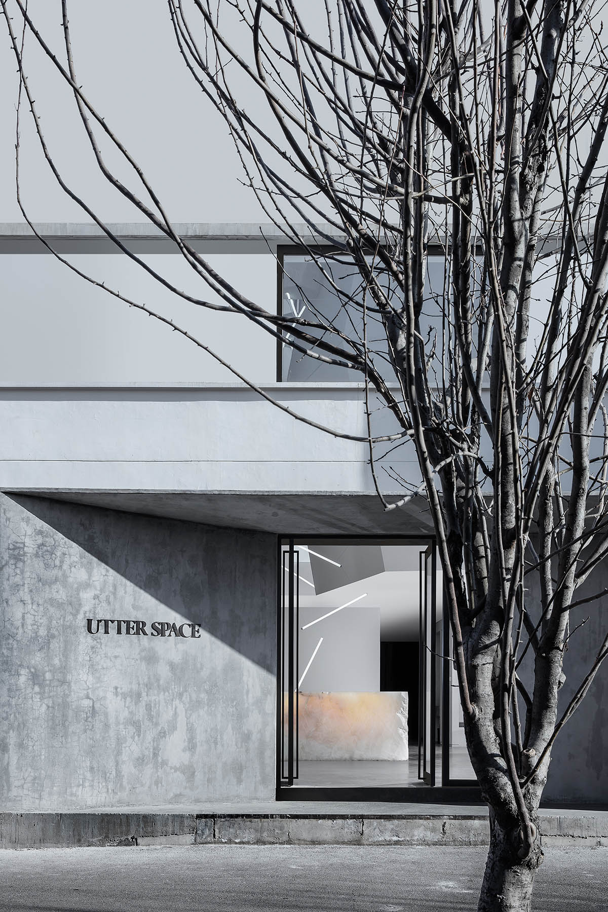 CUN converts old warehouse into a photographer's studio with industrial-looking interior in Beijing