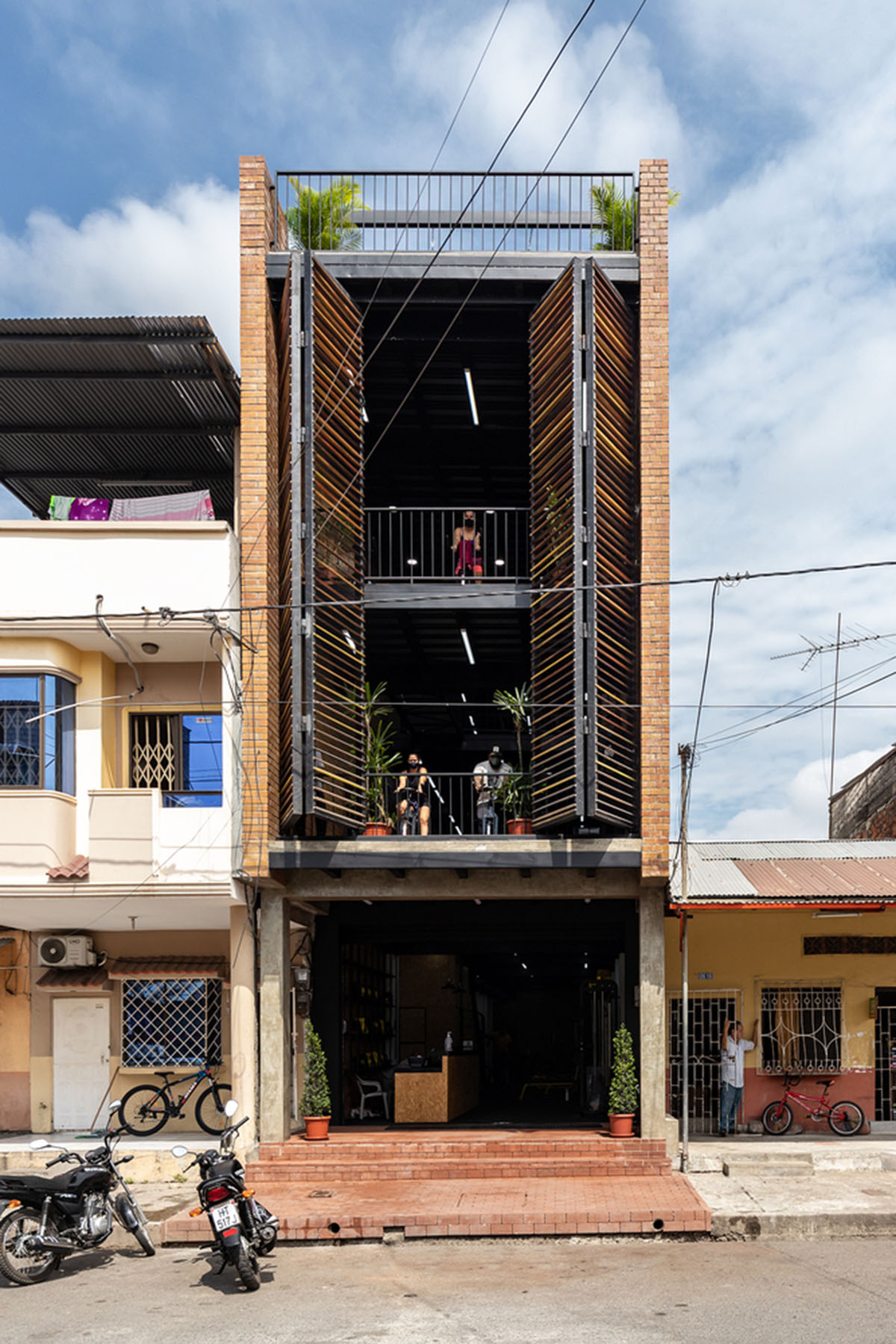 Natura Futura Arquitectura built training center featuring 8-metre-long wooden shutter in Ecuador