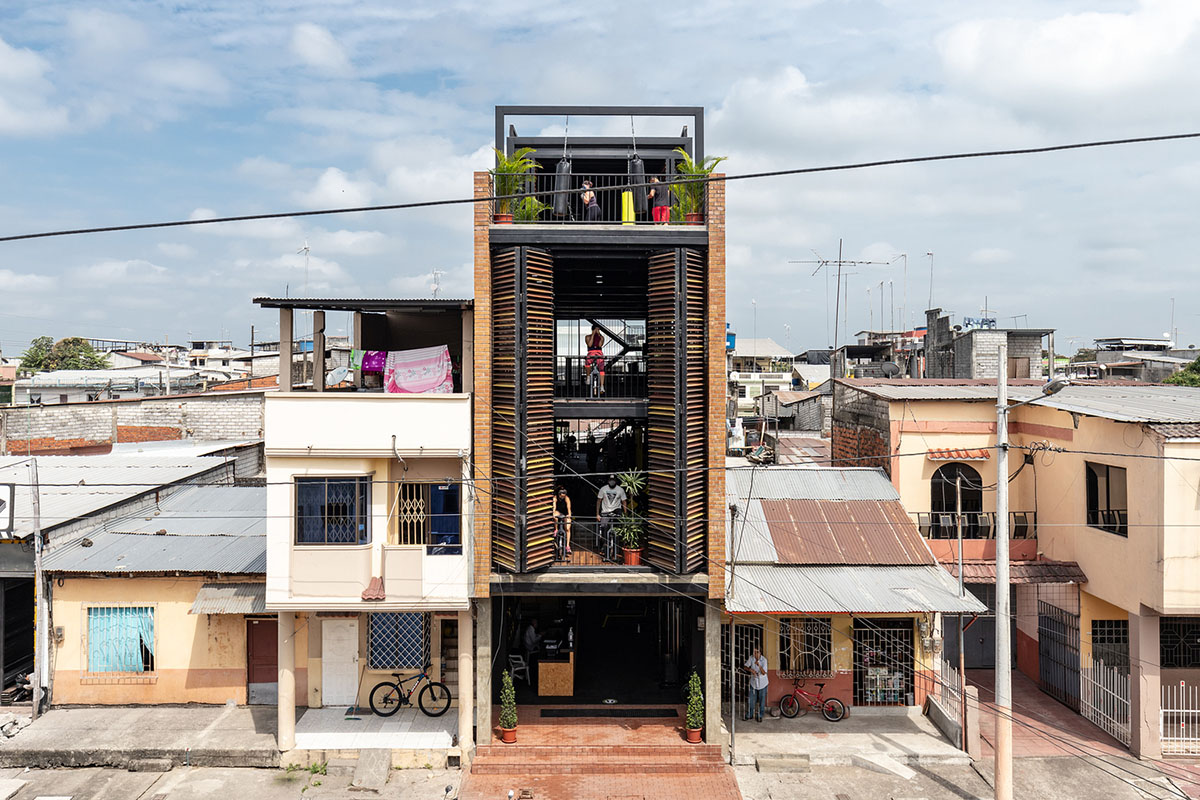 Natura Futura Arquitectura built training center featuring 8-metre-long wooden shutter in Ecuador