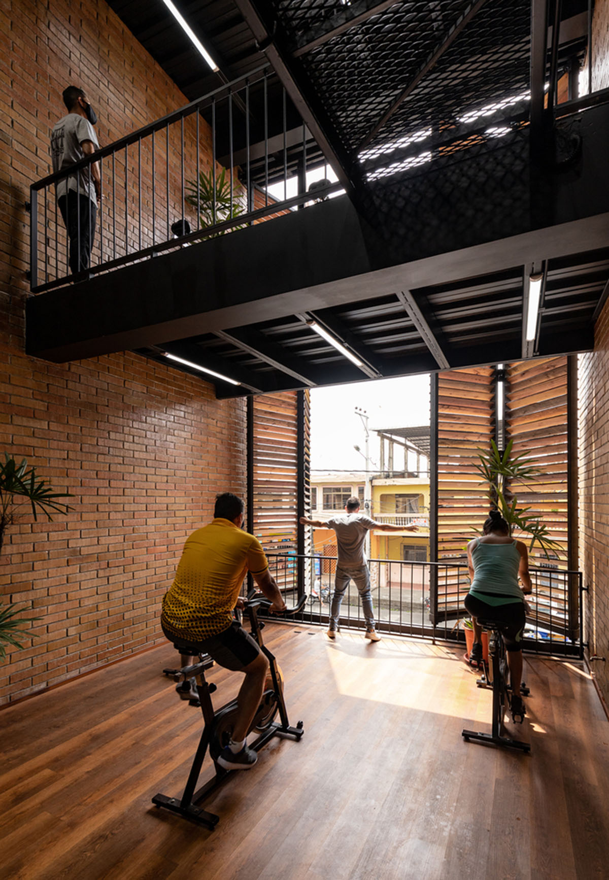 Natura Futura Arquitectura built training center featuring 8-metre-long wooden shutter in Ecuador