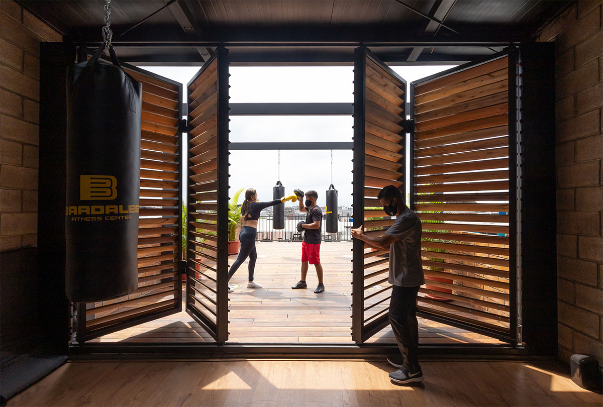 Natura Futura Arquitectura built training center featuring 8-metre-long wooden shutter in Ecuador