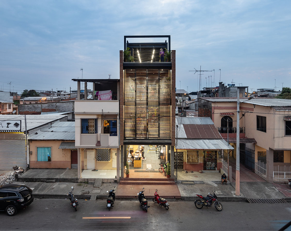 Natura Futura Arquitectura built training center featuring 8-metre-long wooden shutter in Ecuador