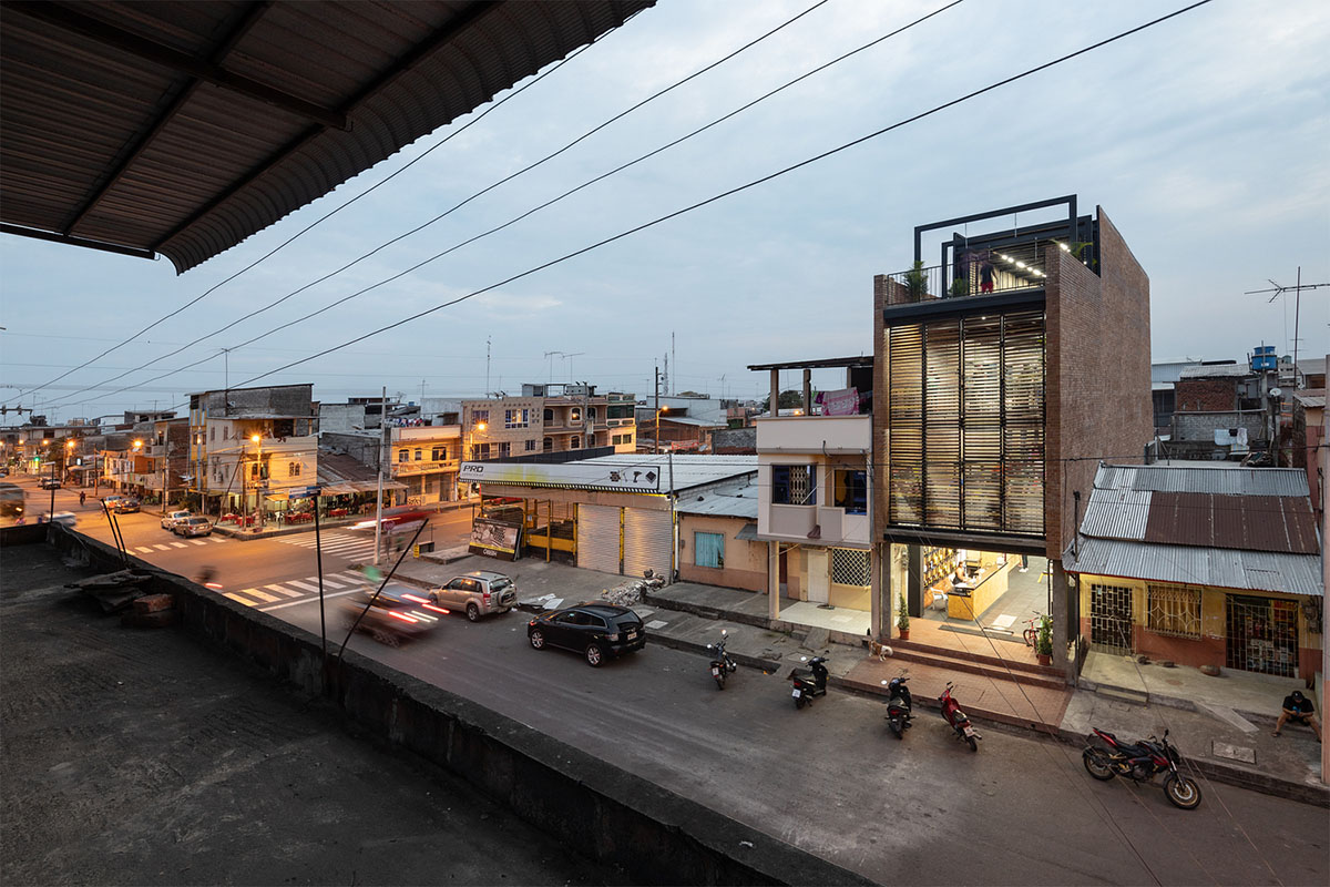 Natura Futura Arquitectura built training center featuring 8-metre-long wooden shutter in Ecuador