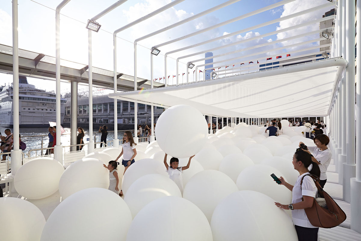Snarkitecture fills giant steel cage with white bouncy balls at Harbour City of Hong Kong