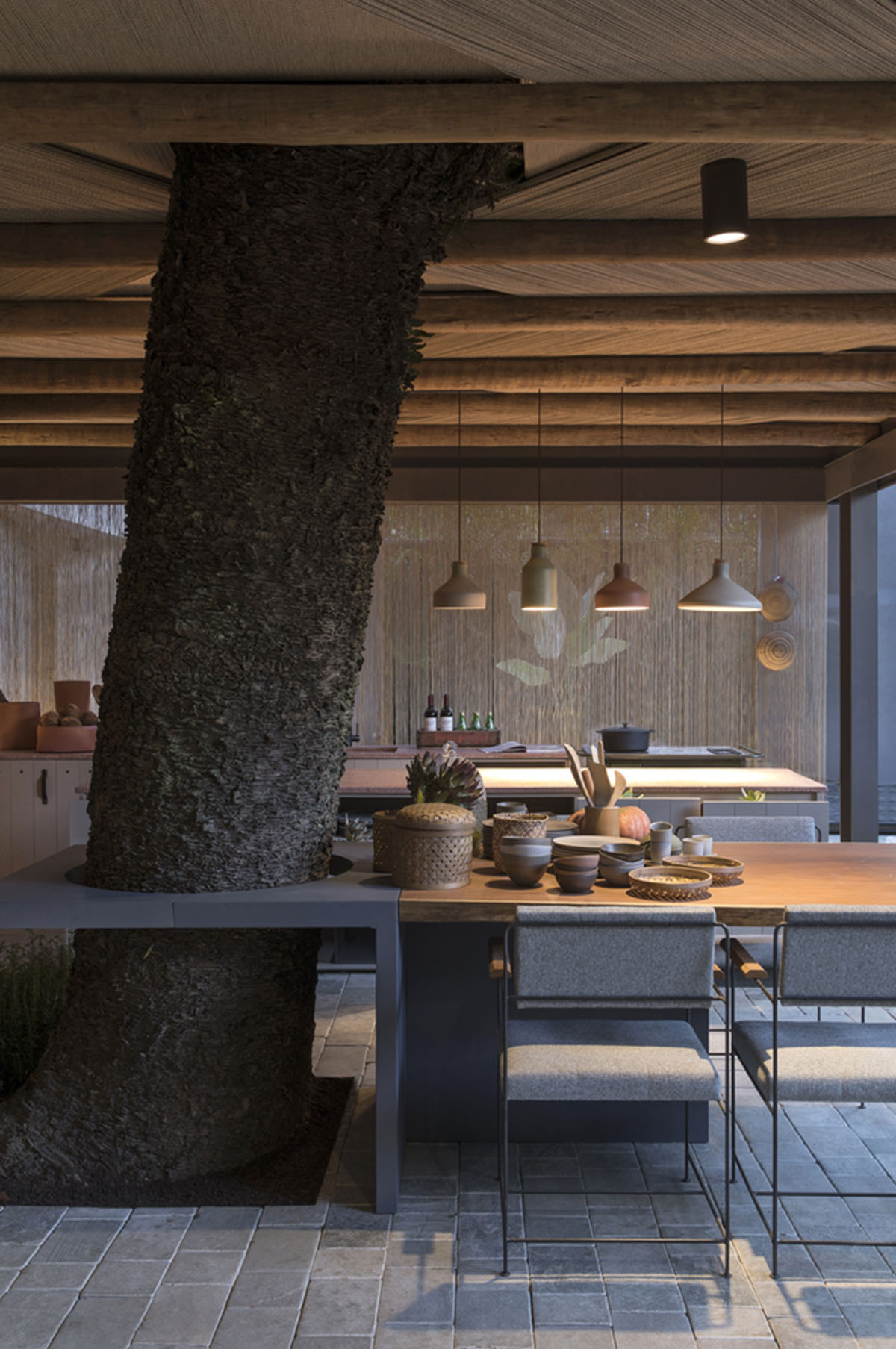 Nature-based toned material palette dominates the interior of Roots House by Triplex Arquitetura