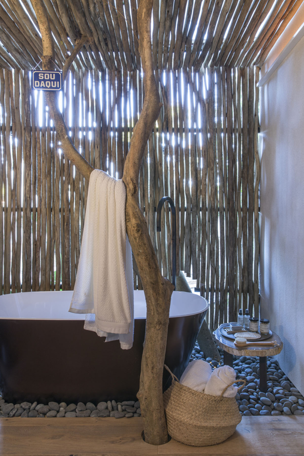 Nature-based toned material palette dominates the interior of Roots House by Triplex Arquitetura