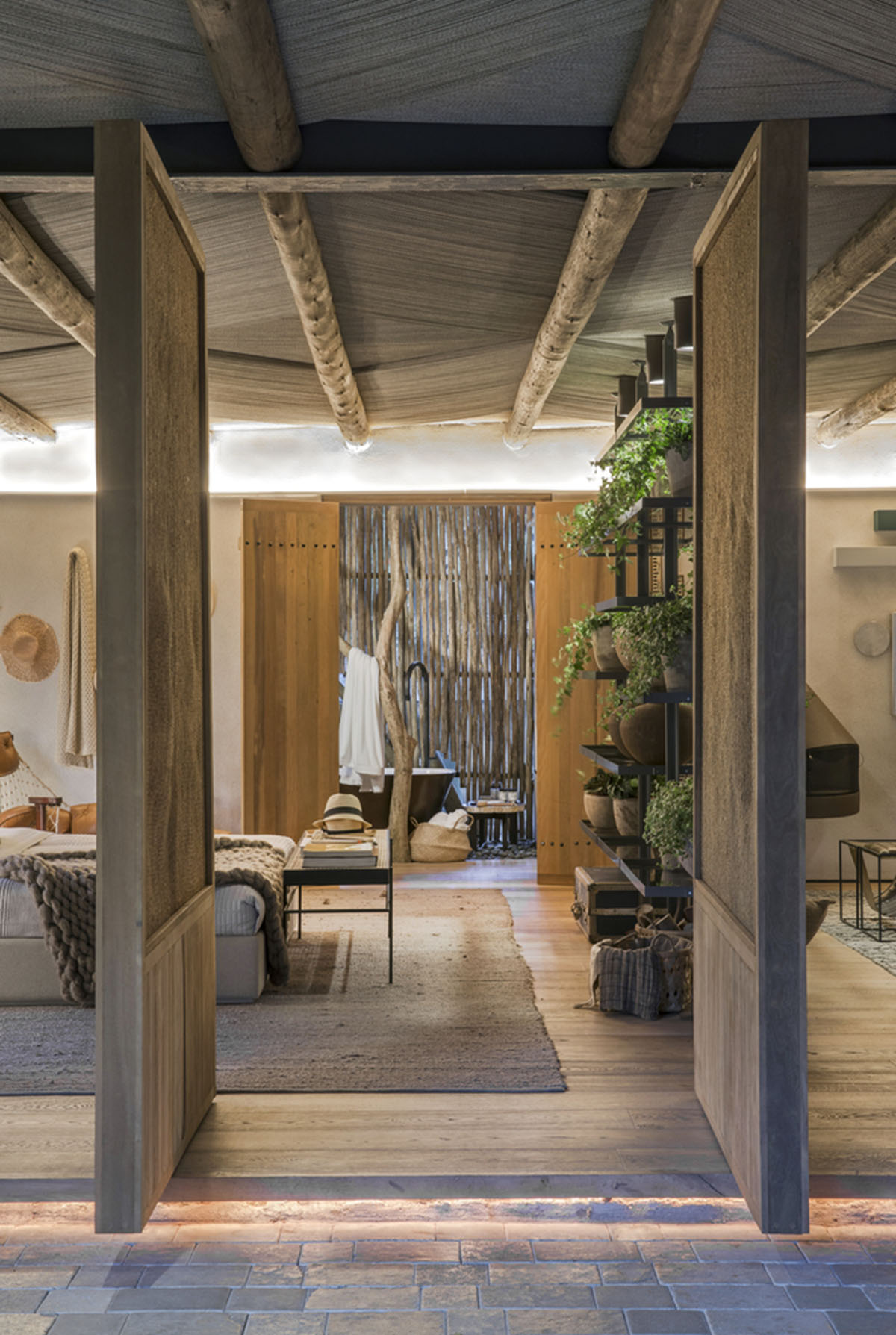 Nature-based toned material palette dominates the interior of Roots House by Triplex Arquitetura