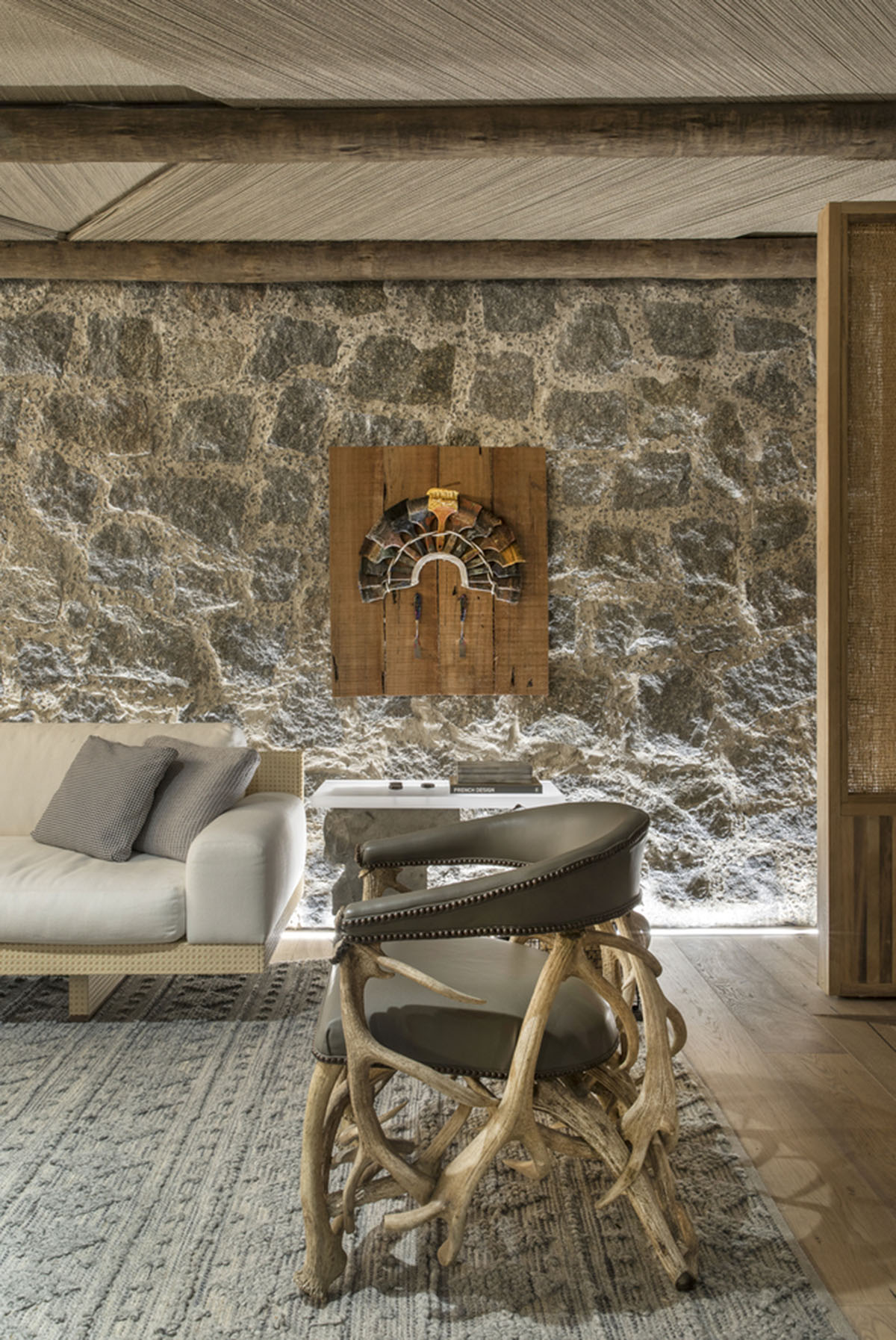 Nature-based toned material palette dominates the interior of Roots House by Triplex Arquitetura