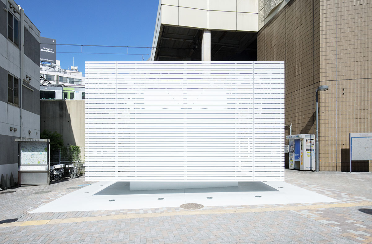 Kashiwa Sato wraps public toilet with white aluminium louvres in central Tokyo