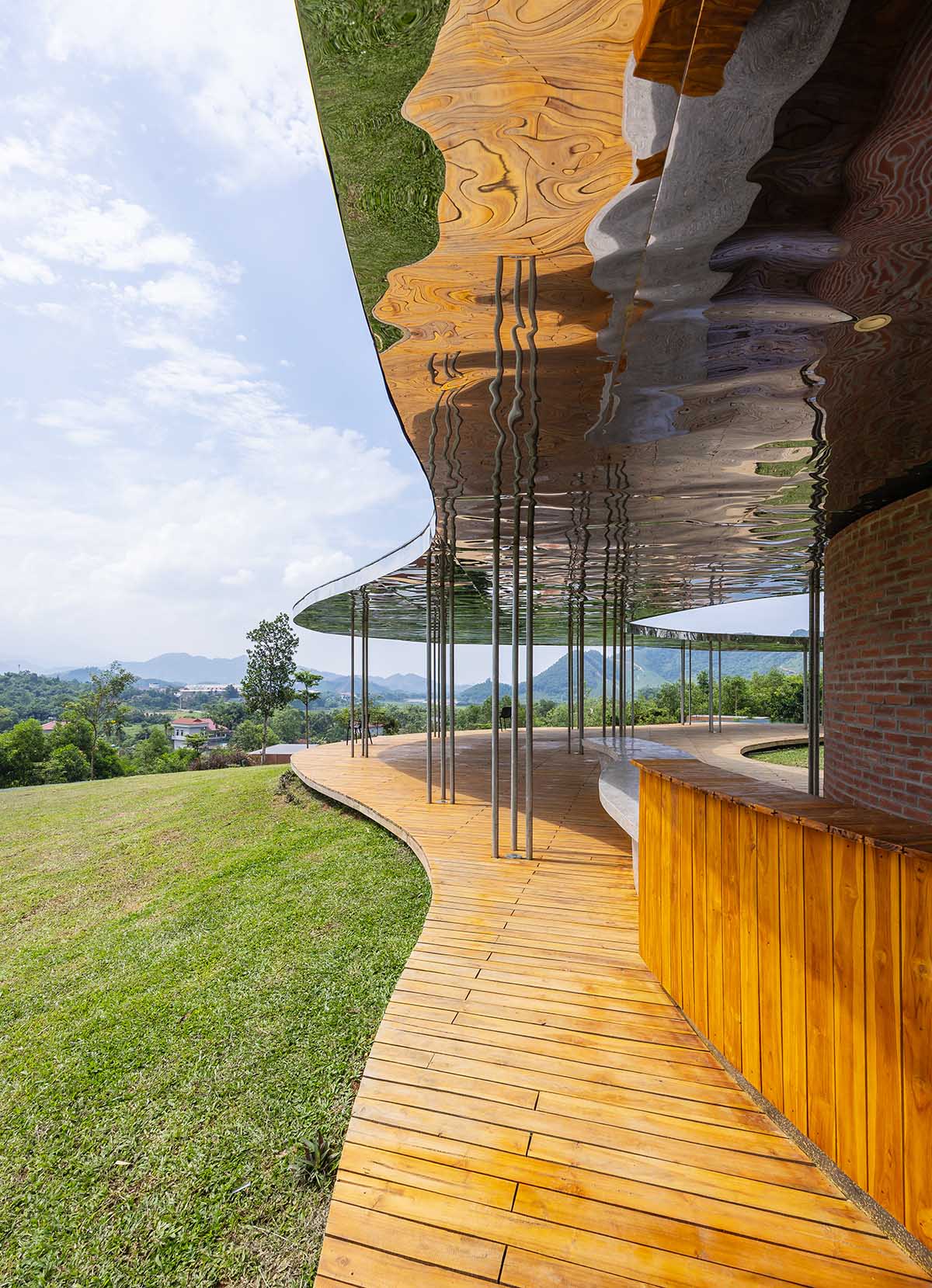 Idee architects creates sinuous and reflective canopy for Quin Pavilion on Hanoi hills