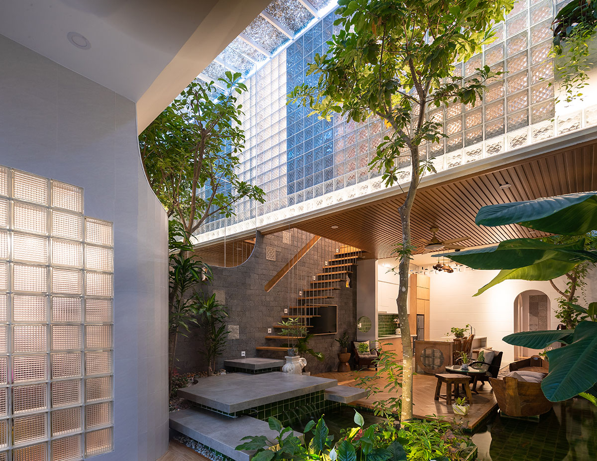 CoCo House, inspired by animated film, is clad in glass brick façade with wavy patterns in Vietnam