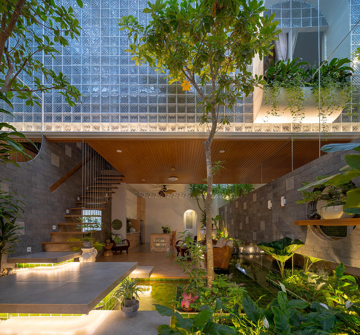 CoCo House, inspired by animated film, is clad in glass brick façade with wavy patterns in Vietnam