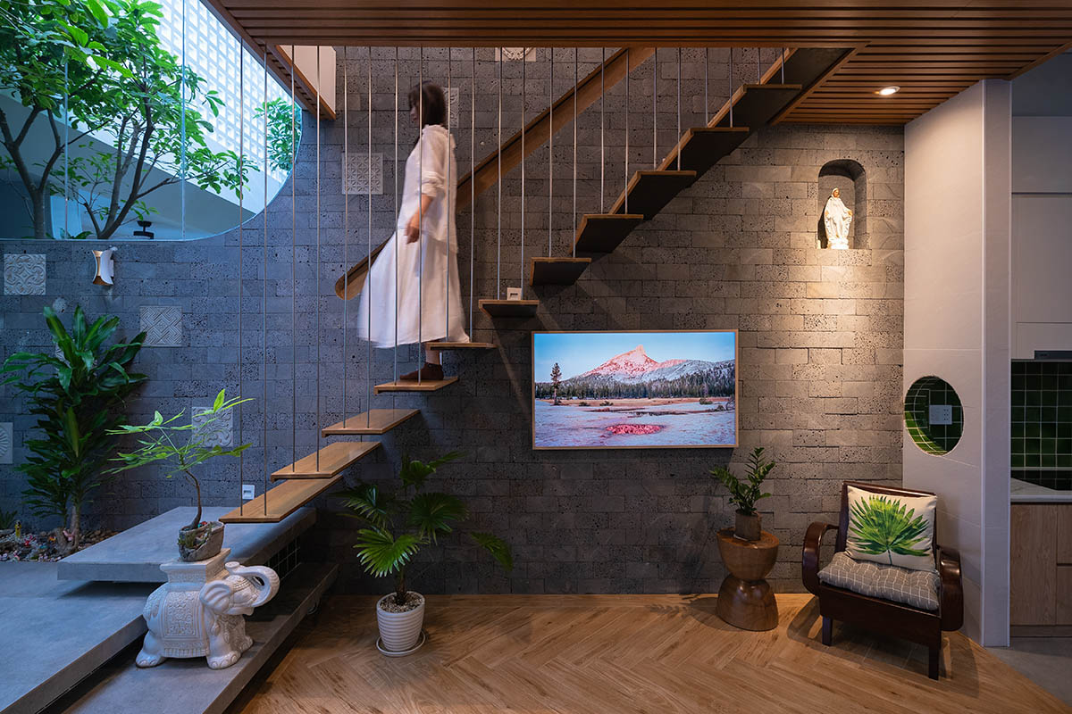 CoCo House, inspired by animated film, is clad in glass brick façade with wavy patterns in Vietnam