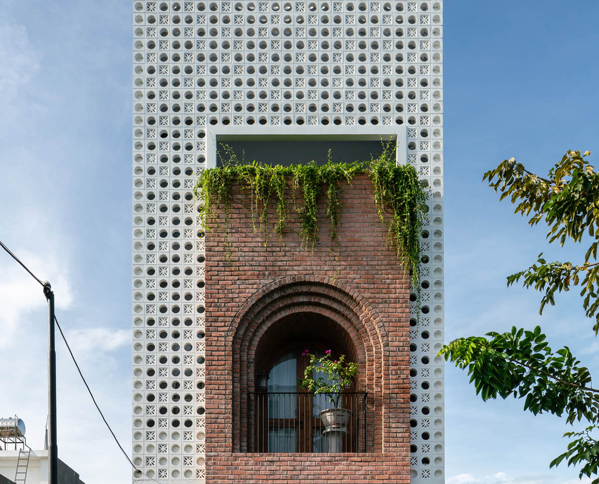 Artistic brick doorways and skylights give more depth to this Vietnamese house designed by Coi Design