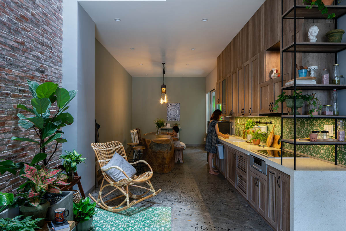 Artistic brick doorways and skylights give more depth to this Vietnamese house designed by Coi Design