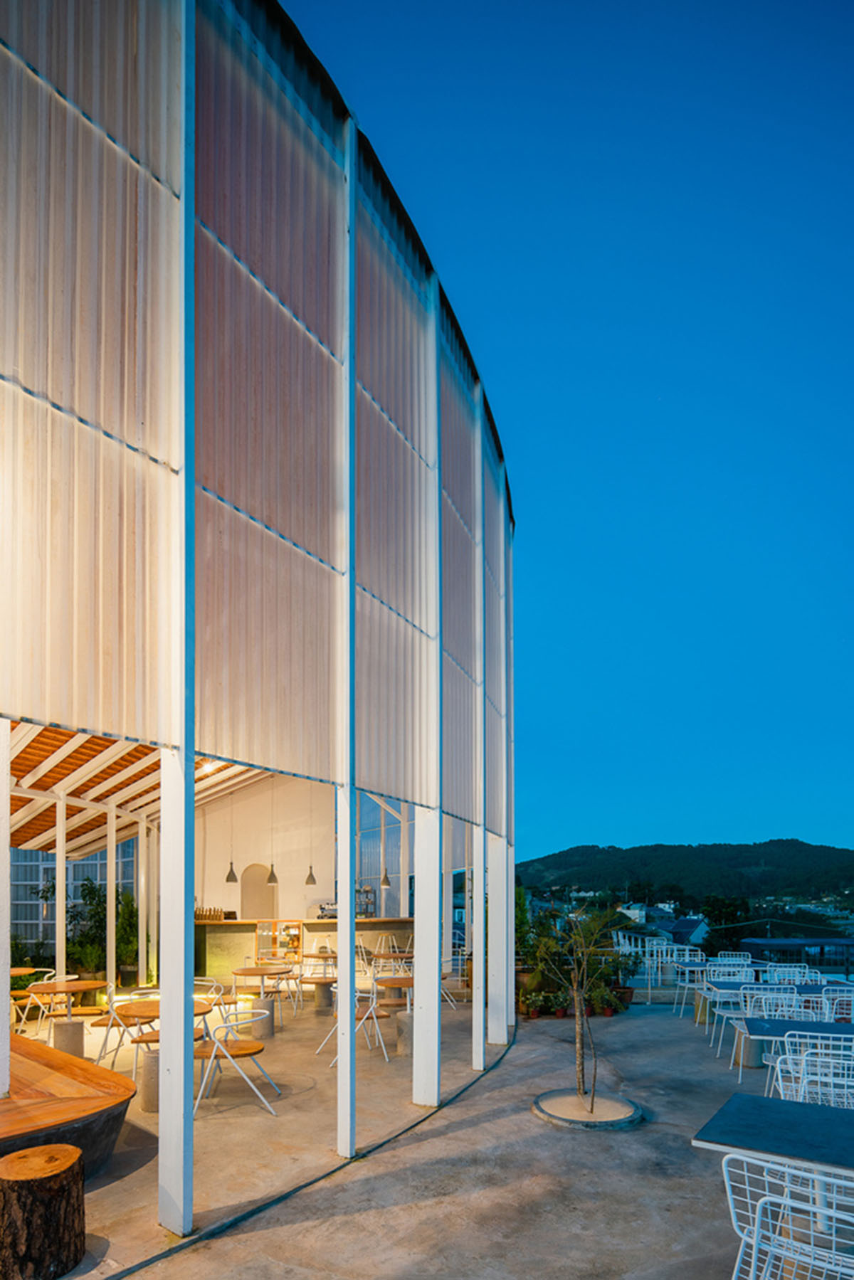 G+ Architects completes all-white circular L00P Boutique Hotel and Café in Vietnam