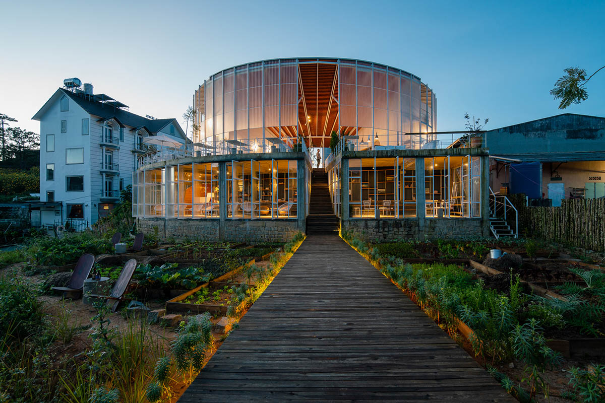 G+ Architects completes all-white circular L00P Boutique Hotel and Café in Vietnam