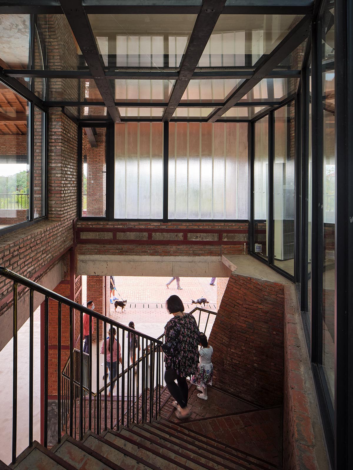Thick brick walls redefine a historic kiln as a public space and multi-purpose hall in Pudong