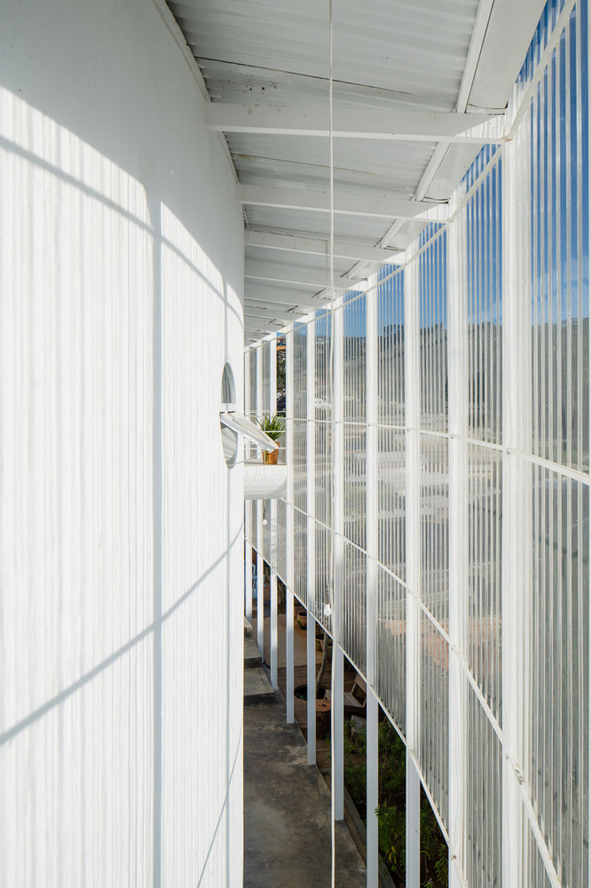 G+ Architects completes all-white circular L00P Boutique Hotel and Café in Vietnam