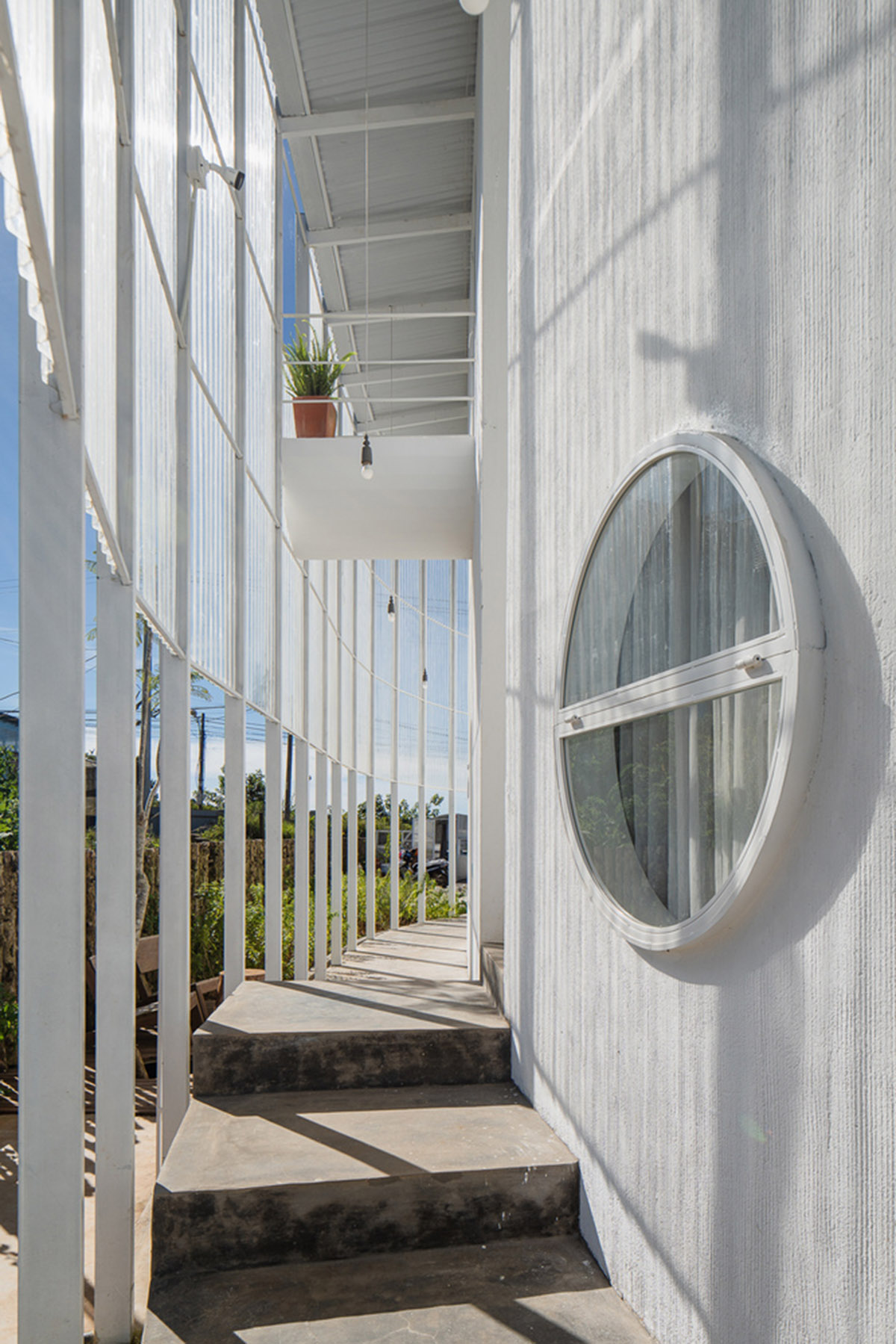 G+ Architects completes all-white circular L00P Boutique Hotel and Café in Vietnam
