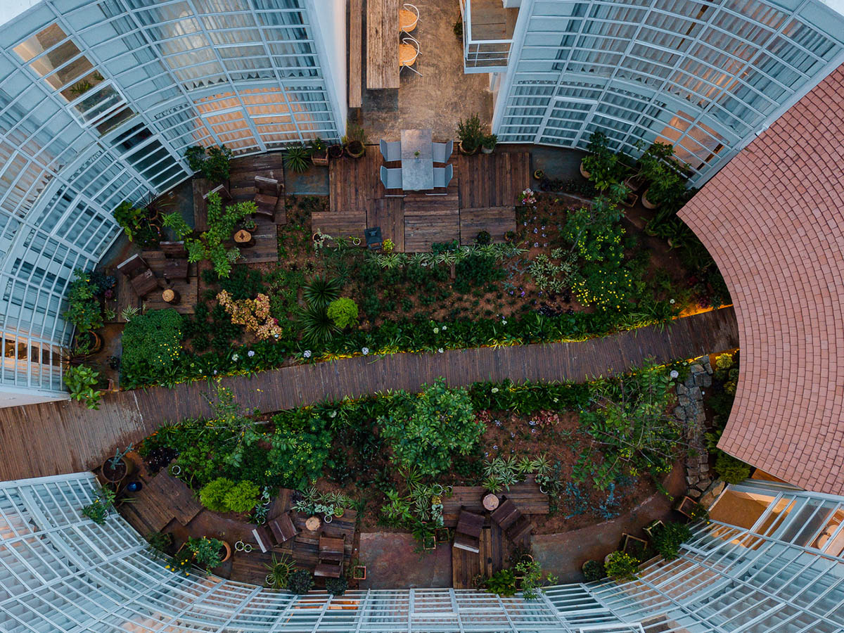 G+ Architects completes all-white circular L00P Boutique Hotel and Café in Vietnam