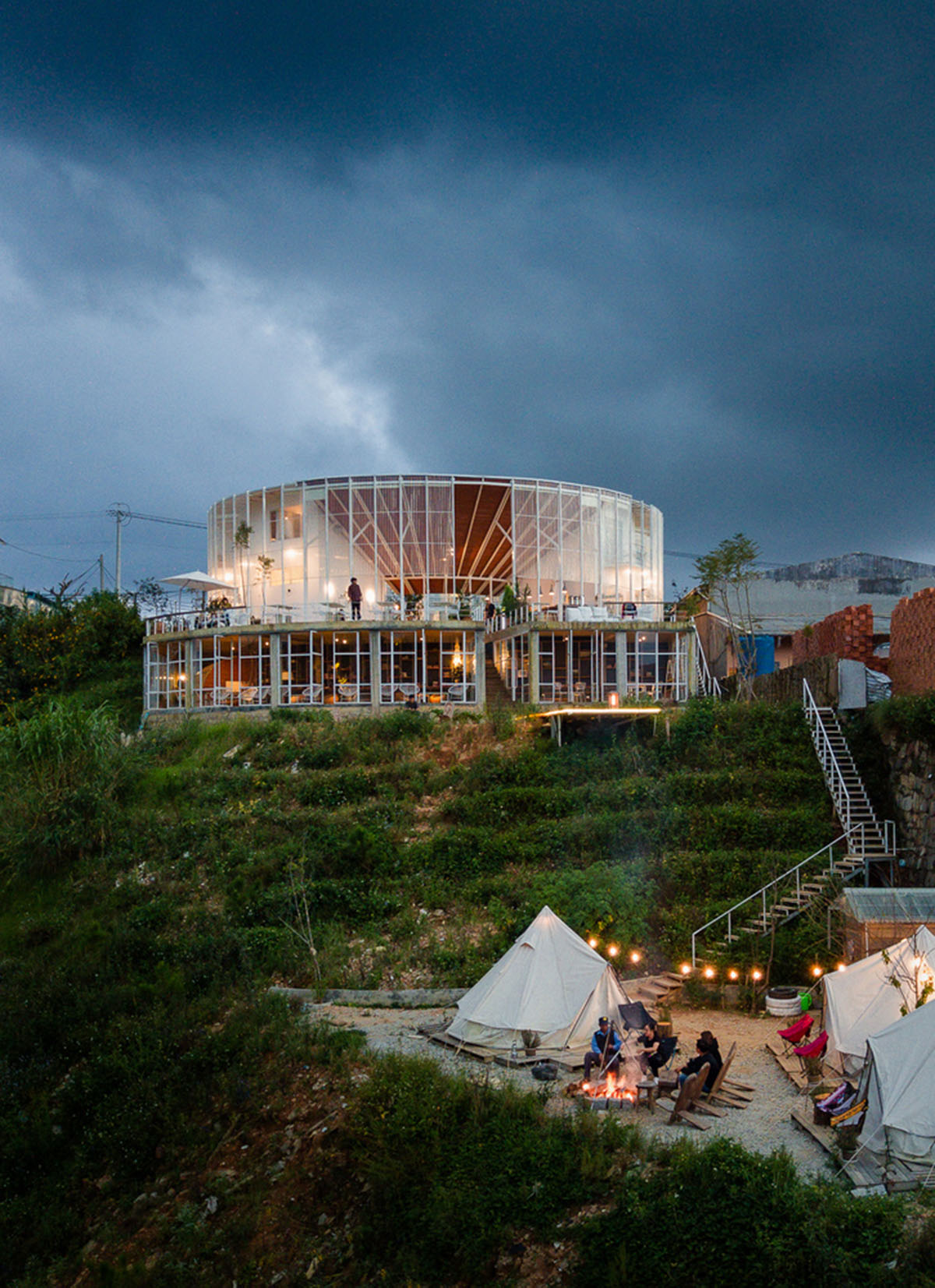 G+ Architects completes all-white circular L00P Boutique Hotel and Café in Vietnam