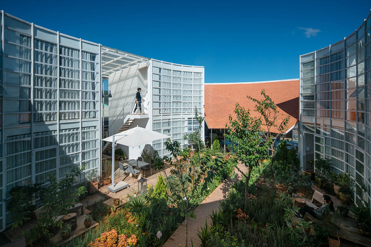 G+ Architects completes all-white circular L00P Boutique Hotel and Café in Vietnam