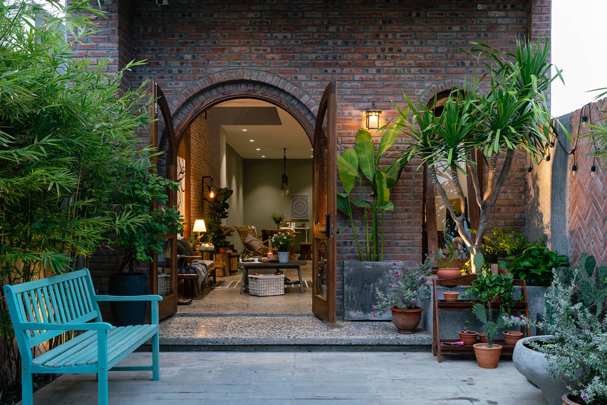 Artistic brick doorways and skylights give more depth to this Vietnamese house designed by Coi Design