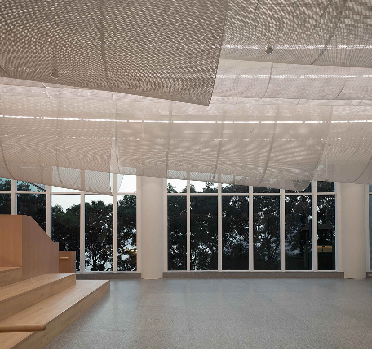 Atelier Nuno Architects suspends tubular aluminum panels from the ceiling of a lobby in Hong Kong