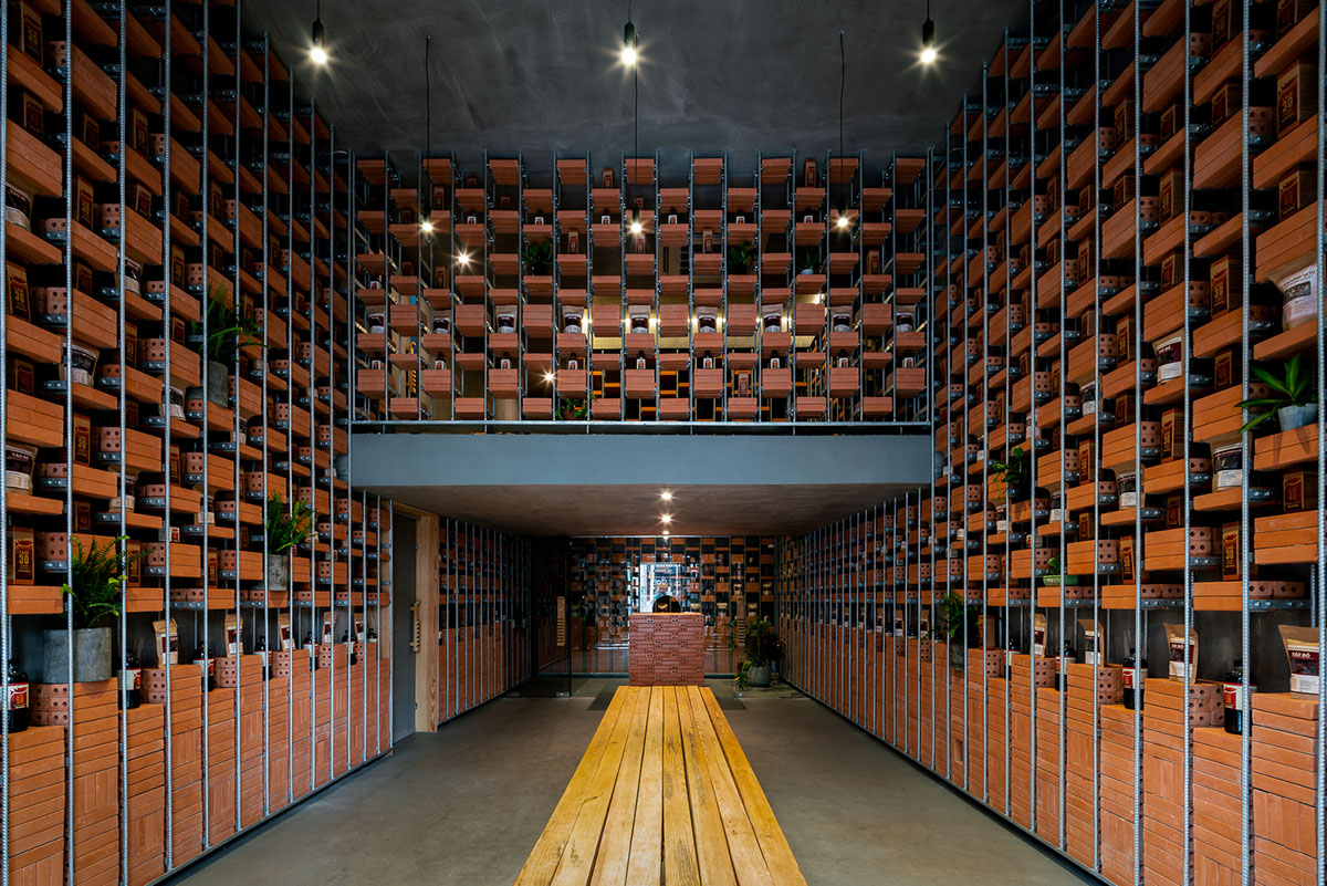 Tropical Space uses brick shelves to convert old house into an organicare showroom in Vietnam