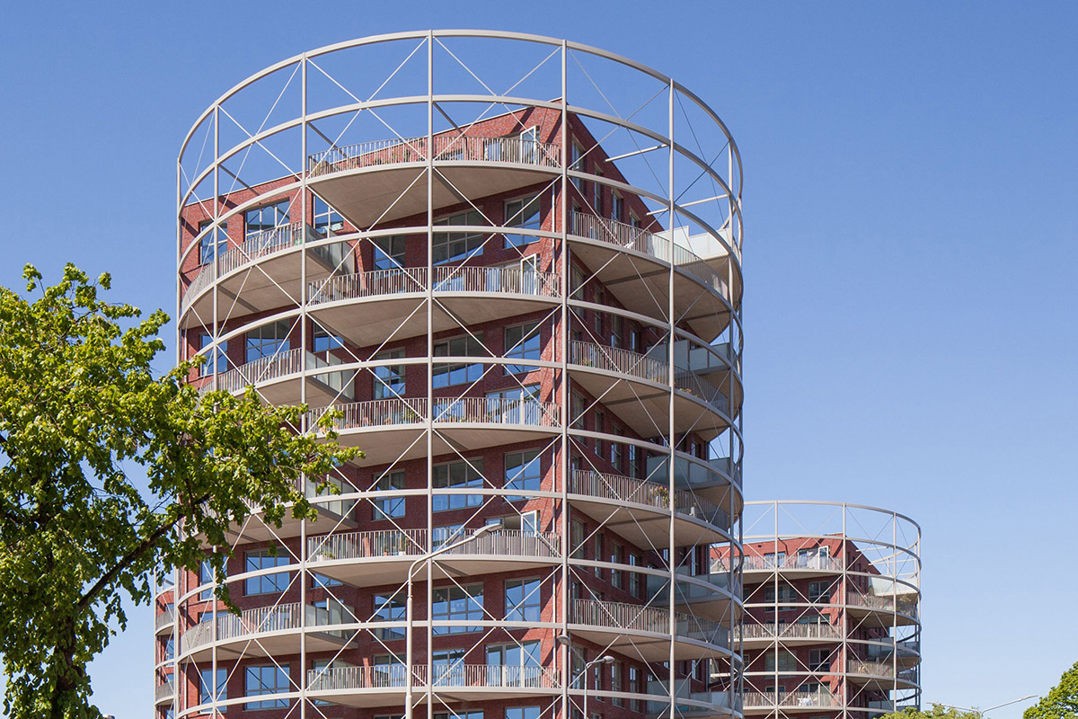 Mecanoo completes Villa Industria with red-brown bricks in a former gasworks site of Hilversum