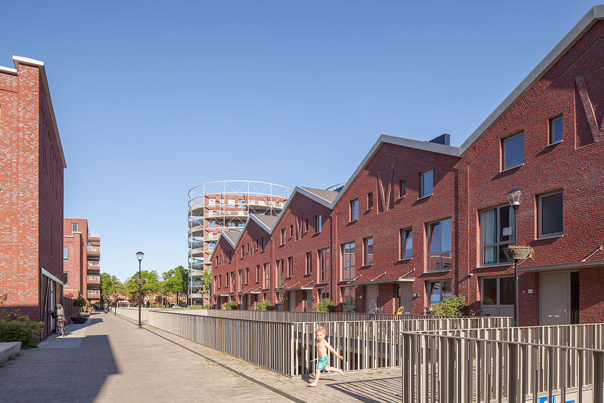 Mecanoo completes Villa Industria with red-brown bricks in a former gasworks site of Hilversum