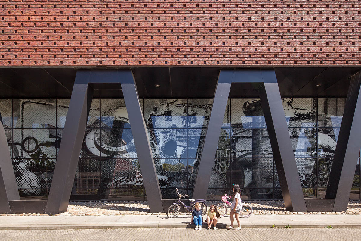 Mecanoo completes Villa Industria with red-brown bricks in a former gasworks site of Hilversum