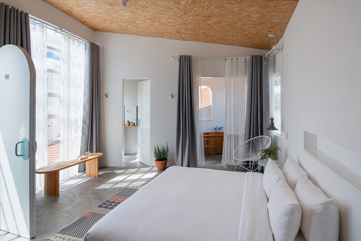 G+ Architects completes all-white circular L00P Boutique Hotel and Café in Vietnam