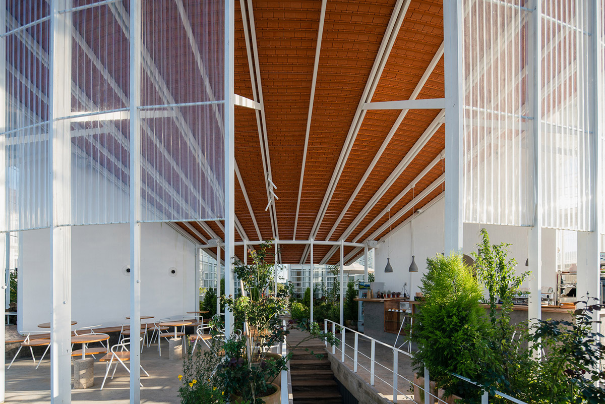 G+ Architects completes all-white circular L00P Boutique Hotel and Café in Vietnam