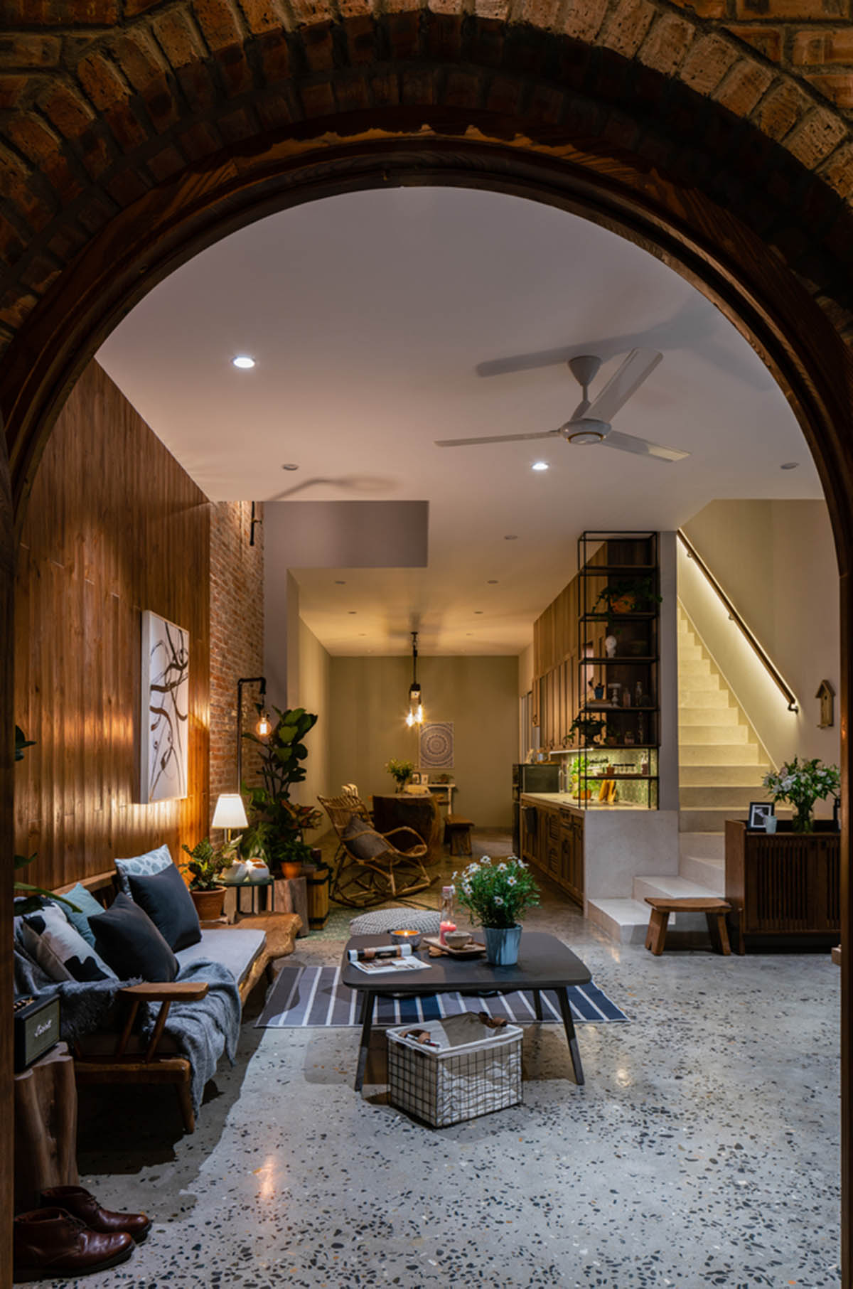 Artistic brick doorways and skylights give more depth to this Vietnamese house designed by Coi Design
