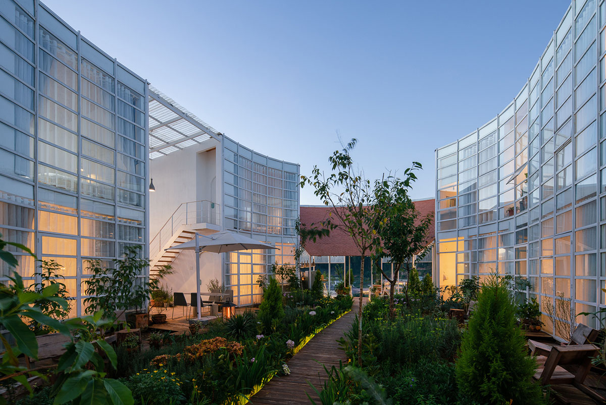 G+ Architects completes all-white circular L00P Boutique Hotel and Café in Vietnam