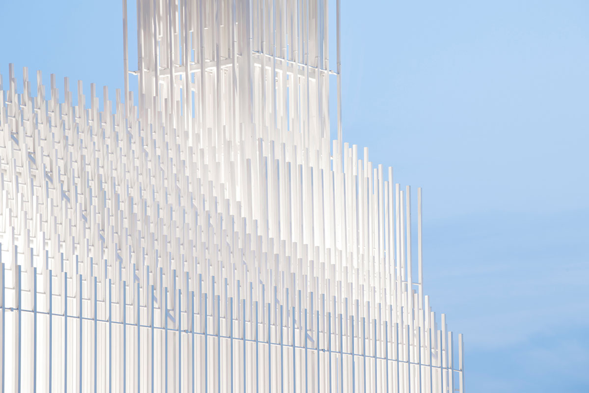 A church made of thousands of white thin beams looks like suspended in the air in lavender field