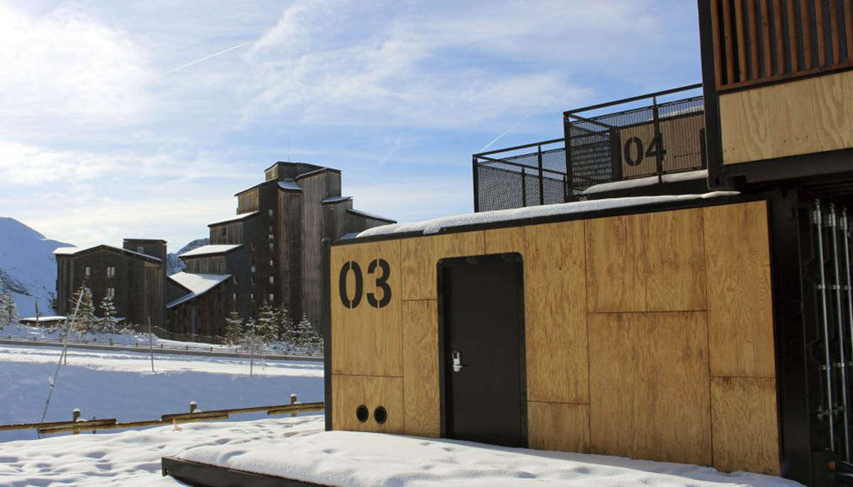 Real wooden shipping containers provide nomadic accommodation designed by Ora Ito