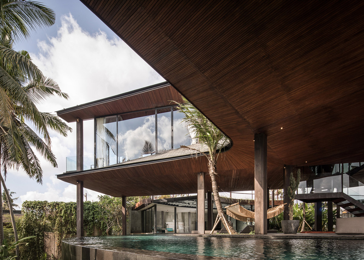 Alexis Dornier's cross-shaped house elevated on stilts to include continuous living space underneath