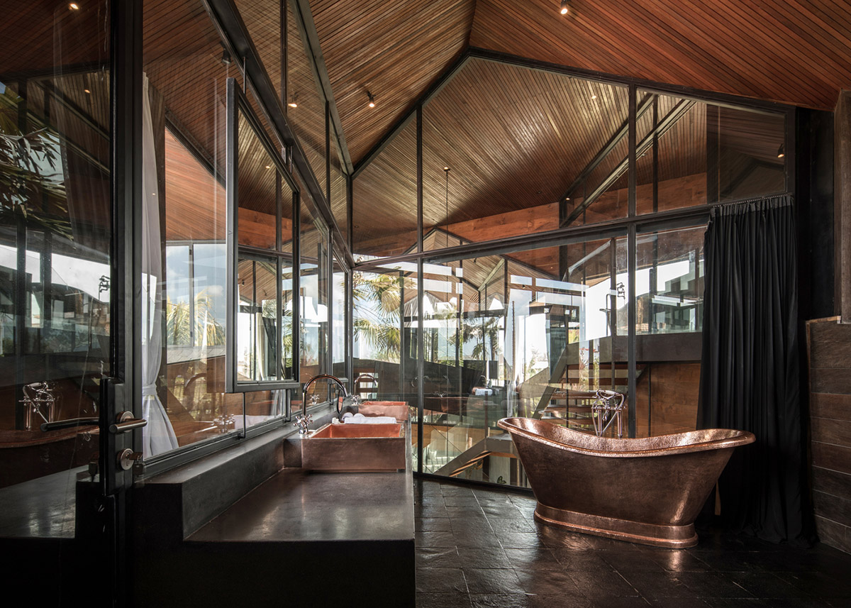 Alexis Dornier's cross-shaped house elevated on stilts to include continuous living space underneath