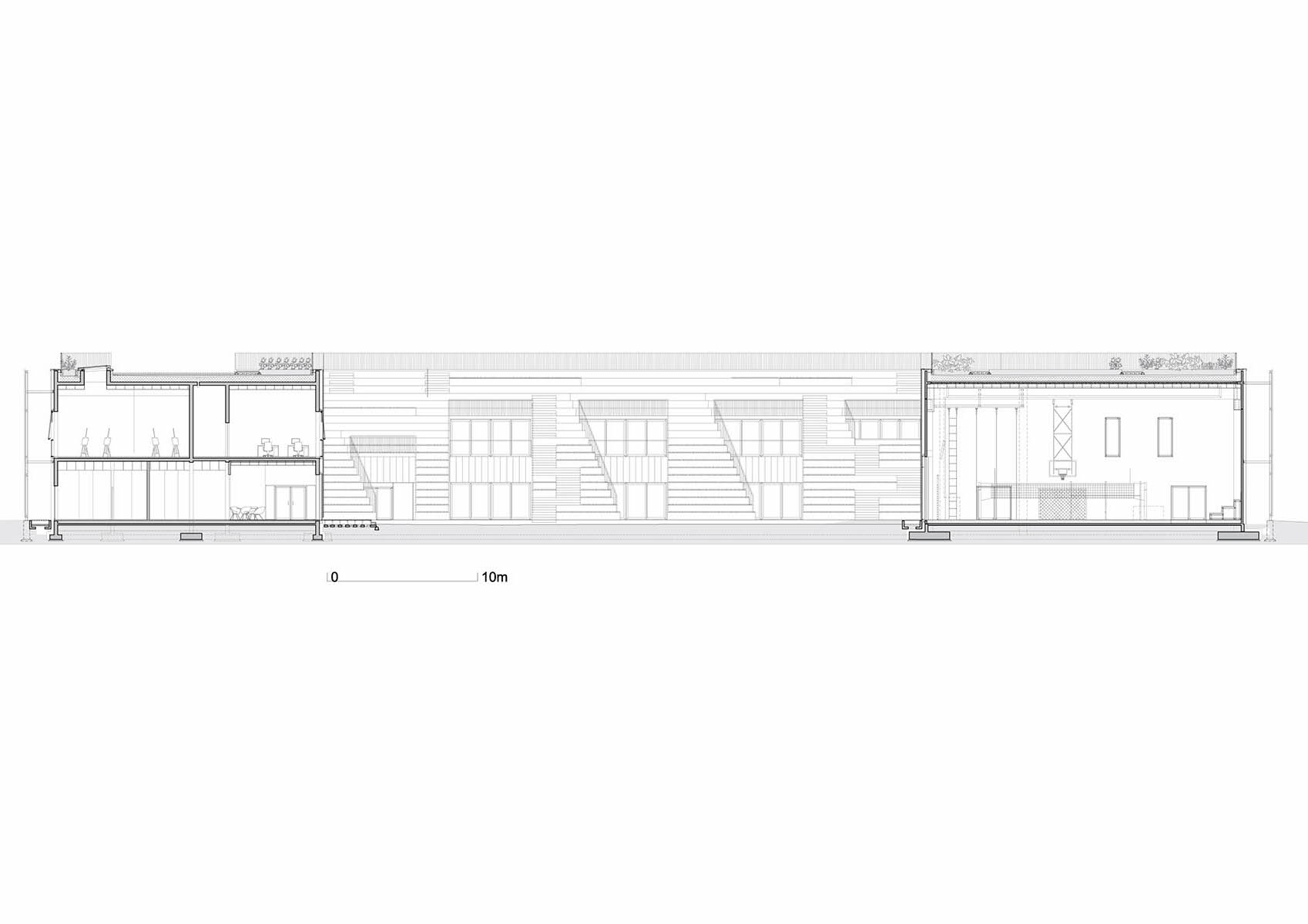 Huge tribunes invite students to sit and experience the courtyard in Warsaw's Akademeia High School